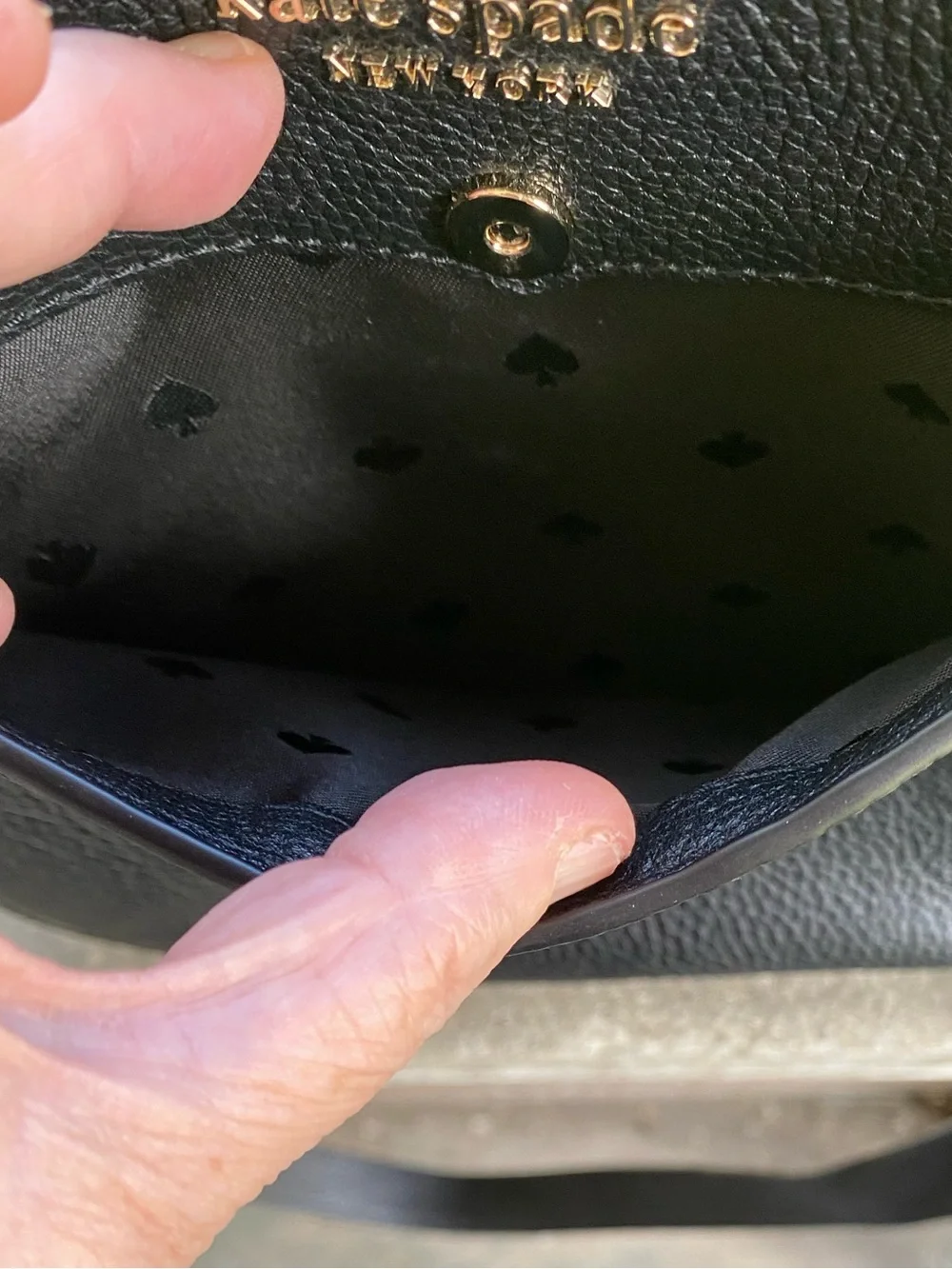 kate spade black pebbled leather crossbody with gold logo